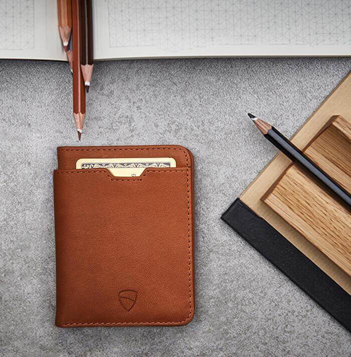 Vaultskin CITY's cognac leather purse showcases precision engineering for a slim, efficient design with RFID blocking for enhanced security